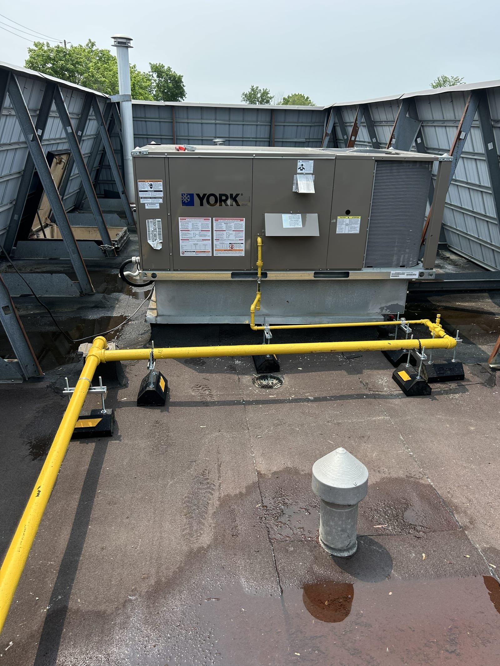 York rooftop HVAC unit with yellow gas piping